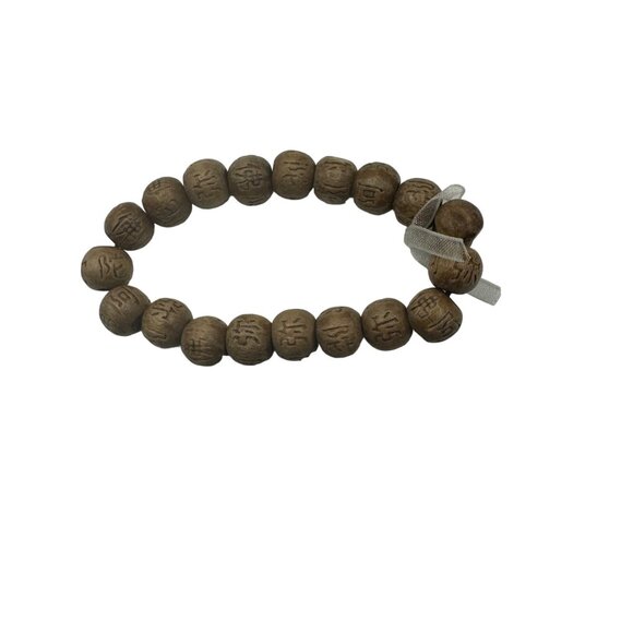 Hand-Carved Wooden Look Bead Bracelet With Intricate Symbols - Picture 5 of 5